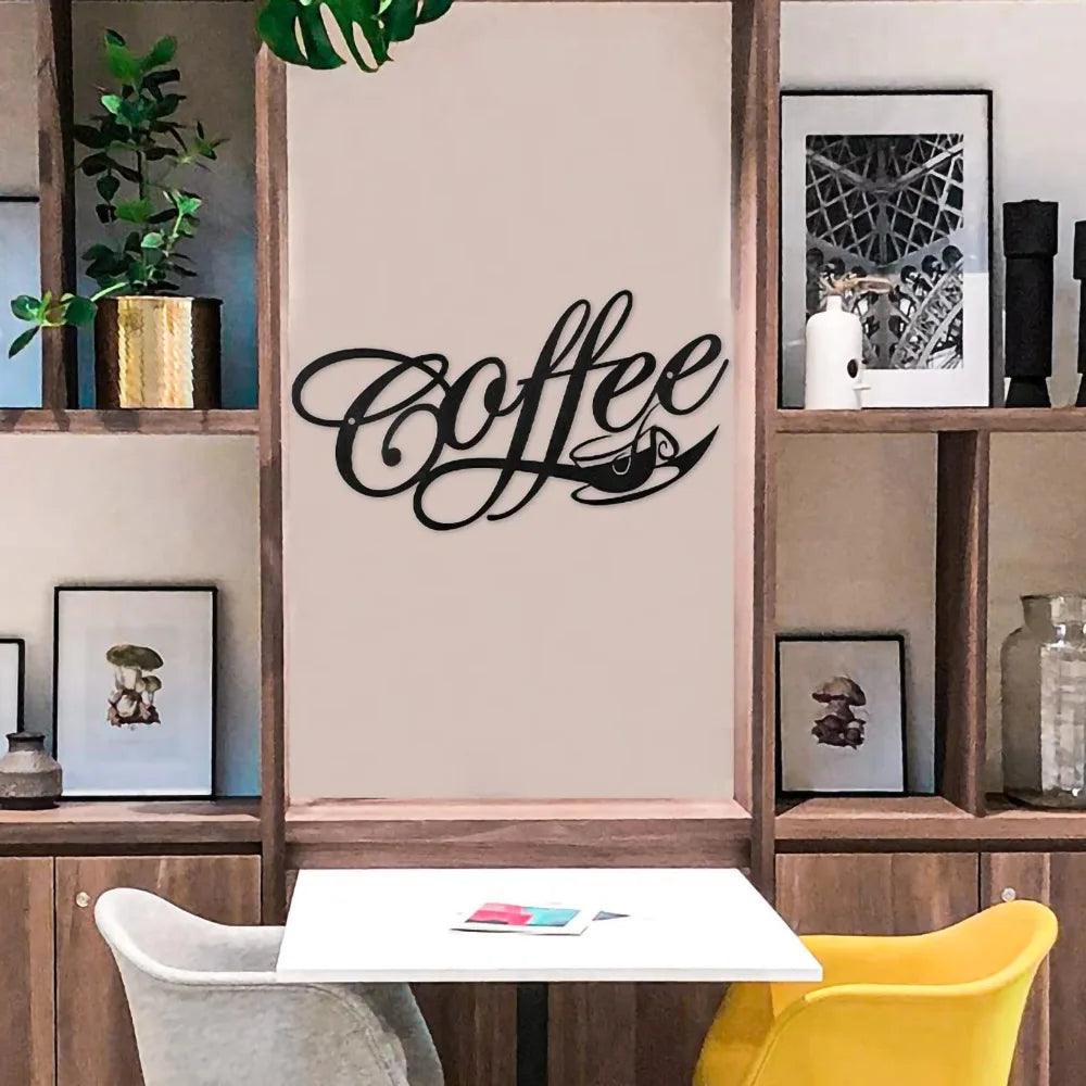 A cozy café interior with a small white table and two chairs, one yellow and one grey. Shelves with plants, photos, and decorative items adorn the walls for home decoration. Prominently displayed in the center is the &quot;COFFEE Metal Word Cafe Wall Sign Hanging Kitchen Black Plaque Art Home Decoration Bar Plaque Silhouette Decor&quot; by Costa Rica Coffee Friends, featuring a bold black word sign that reads &quot;Coffee,&quot; accented with a coffee cup design.