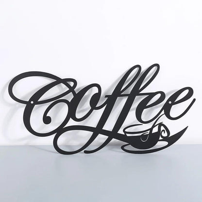 The COFFEE Metal Word Cafe Wall Sign by Costa Rica Coffee Friends features an elegant black metal design that spells &quot;Coffee,&quot; making it ideal for home decoration. The tail of the letter &quot;e&quot; seamlessly transitions into a small coffee cup with a saucer, accented by swirling steam. This sophisticated black plaque is set against a plain white background.